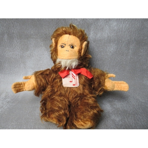 92 - A VINTAGE MERRYTHOUGHT MUSICAL 'THUMPER' SOFT TOY, H 41 cm, together with a musical Music Reuge bear... 