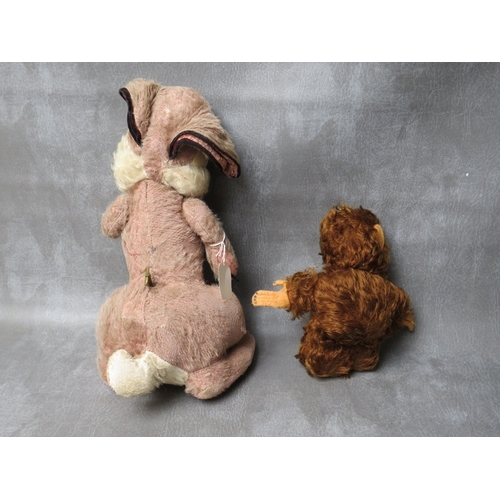 92 - A VINTAGE MERRYTHOUGHT MUSICAL 'THUMPER' SOFT TOY, H 41 cm, together with a musical Music Reuge bear... 