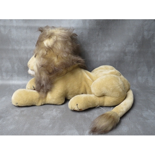 93 - A VINTAGE MERRYTHOUGHT PYJAMA CASE IN THE FORM OF A LION, L 50 cm - not including tail, together wit... 