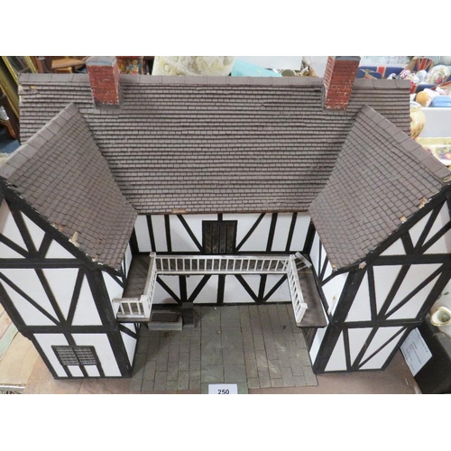 250 - A vintage handmade wooden dolls house