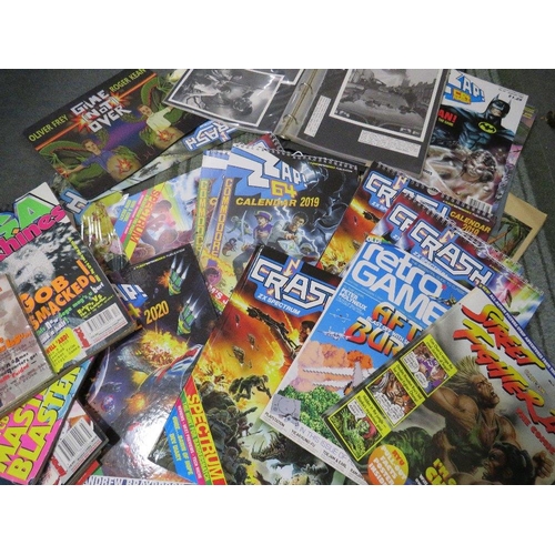 261 - A tray of assorted retro gaming annuals, magazines, books, calendars etc., to include Crash ZX Spect... 