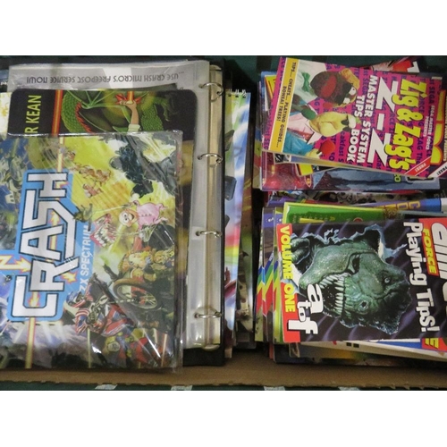 261 - A tray of assorted retro gaming annuals, magazines, books, calendars etc., to include Crash ZX Spect... 