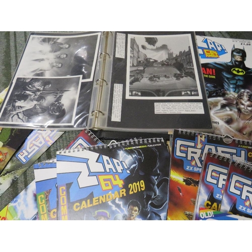 261 - A tray of assorted retro gaming annuals, magazines, books, calendars etc., to include Crash ZX Spect... 