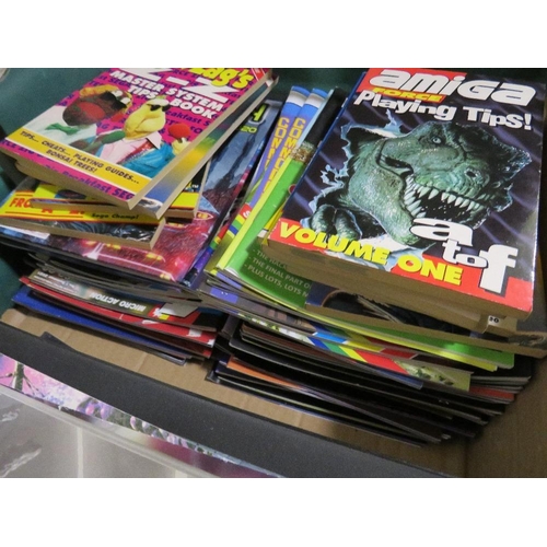 261 - A tray of assorted retro gaming annuals, magazines, books, calendars etc., to include Crash ZX Spect... 