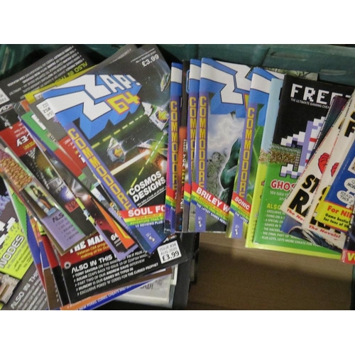 261 - A tray of assorted retro gaming annuals, magazines, books, calendars etc., to include Crash ZX Spect... 