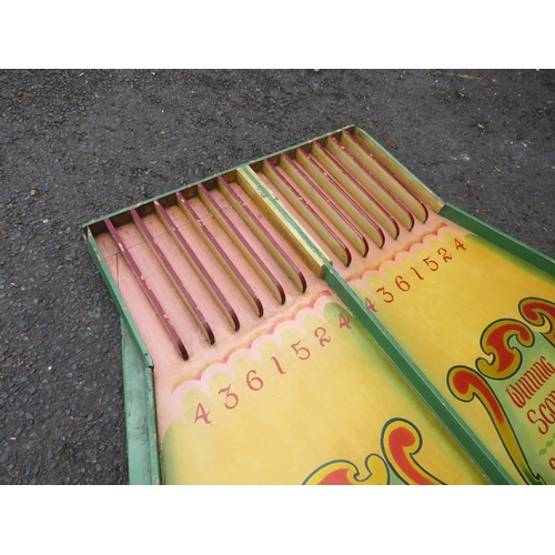 83 - A MID 20TH CENTURY PAINTED WOOD FAIRGROUND ROLL A BALL GAME BOARD, mainly in green and yellow, 145 c... 