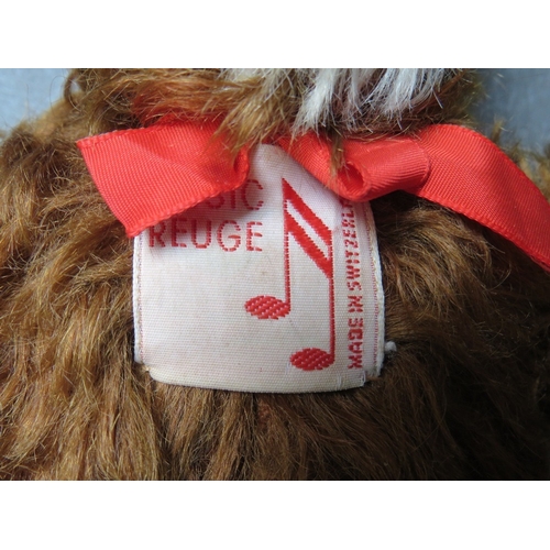 92 - A VINTAGE MERRYTHOUGHT MUSICAL 'THUMPER' SOFT TOY, H 41 cm, together with a musical Music Reuge bear... 