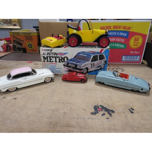 133 - THREE UNBOXED TIN PLATE CARS, to include JNF Duplex with key, Schuco Kommando Anno 200 and another, ... 