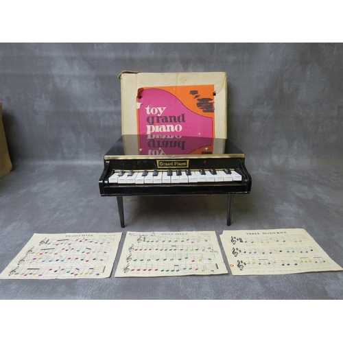 96 - A TOY GRAND PIANO WITH OTIGINAL BOX, in working order at time of consignment