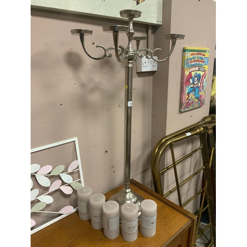 706 - A modern chromed candelabra together with five candles