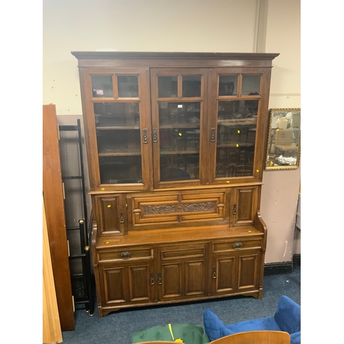 713 - A large Edwardian carved oak display cabinet - stamped ‘Thos Turner Manchester’ to the drawer H 244 ... 