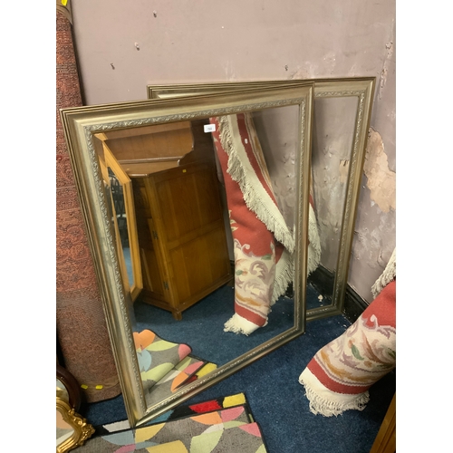 722 - A pair of large modern silver framed rectangular wall mirrors  115 x 89 cm. (2)