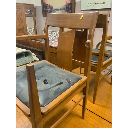 739 - A mid-century teak extending dining table together with six chairs A/F