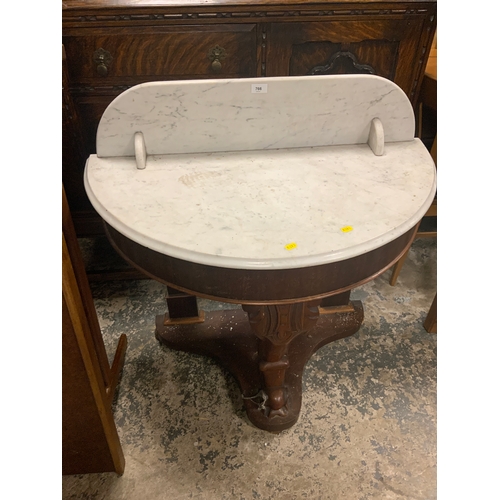 766 - A Marsh Victorian mahogany marble top console table