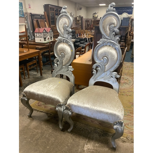 770 - A large pair of modern silver throne chairs