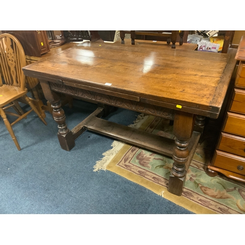 775 - An antique style oak drawleaf table H 77 cm W 132 cm Extended W 208 cm