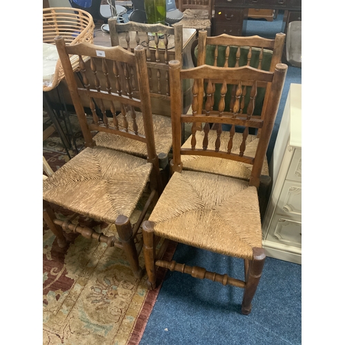 786 - A near set of four antique oak spindle back rush seated chairs