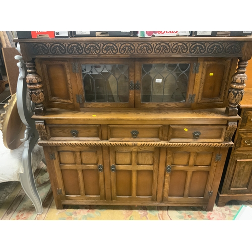 796 - A reproduction oak glazed court cupboard