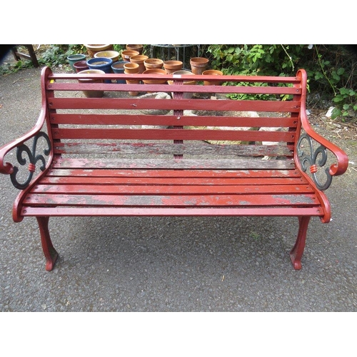 606 - A cast iron garden bench