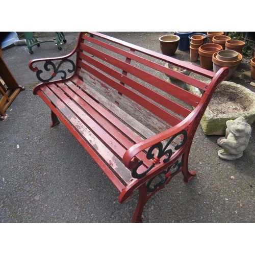 606 - A cast iron garden bench