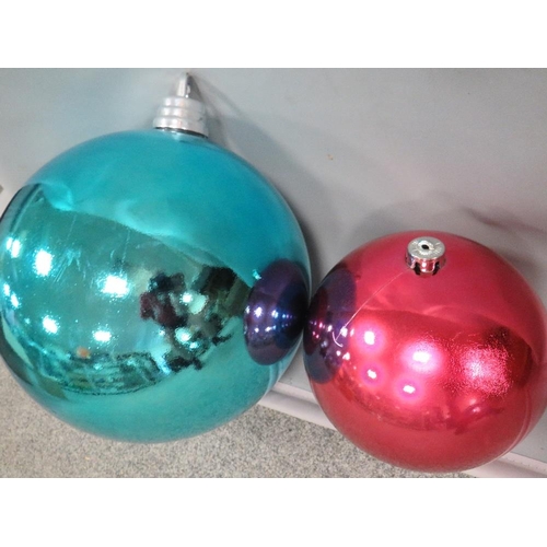 111 - Two large oversized Christmas decorations