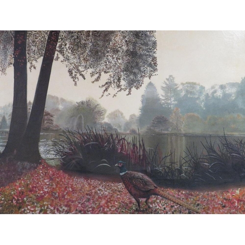 12 - An early 20th century oil on canvas wooded river landscape with pheasant