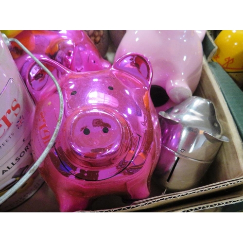 142 - A tray of assorted collectable money boxes and piggy banks