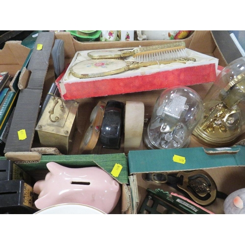 146 - Five trays of collectables to include collectable money banks, table clocks etc