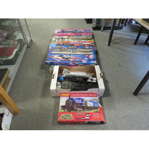 163 - A quantity of boxed Hornby and other train sets together with a box of track and accessories, toy st... 