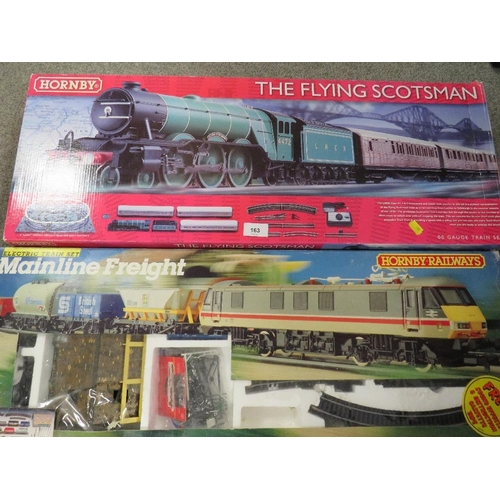 163 - A quantity of boxed Hornby and other train sets together with a box of track and accessories, toy st... 