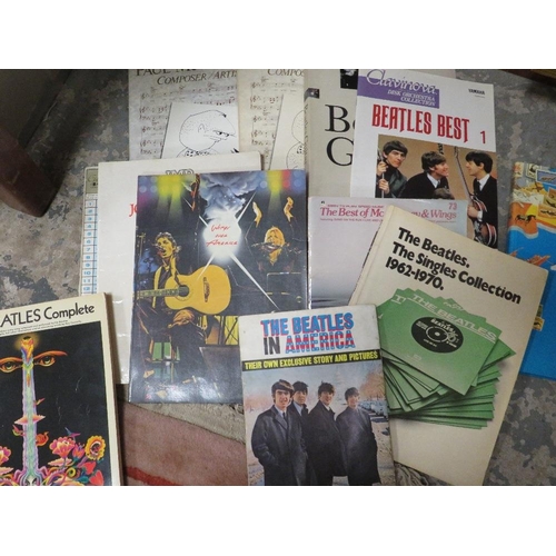 4 - A quantity of Beatles ephemera to include magazines, books and photographs with some reproduction au... 