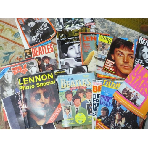 4 - A quantity of Beatles ephemera to include magazines, books and photographs with some reproduction au... 