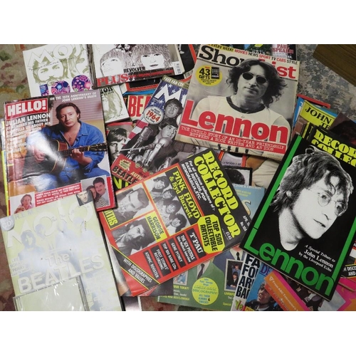 4 - A quantity of Beatles ephemera to include magazines, books and photographs with some reproduction au... 