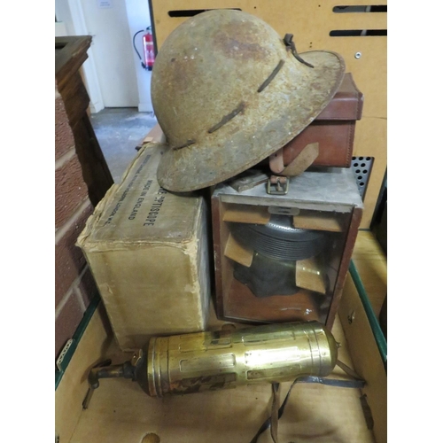 79 - A tray of militaria to include steel helmet, binoculars, WW2 gas mask, Sam Browne belt etc