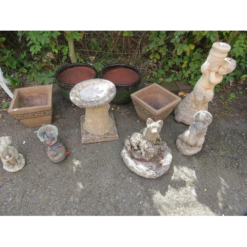 604 - A selection of planters and concrete garden ornaments