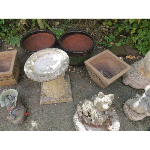 604 - A selection of planters and concrete garden ornaments