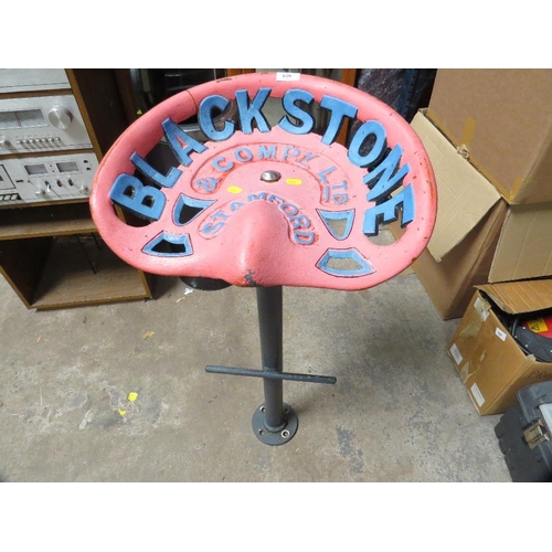 626 - A cast iron tractor seat