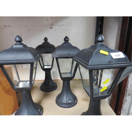 630 - A box of four garden lamps