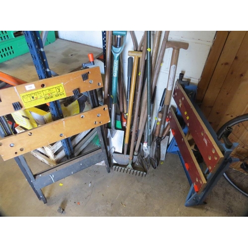 650 - A quantity of assorted garden tools plus a work bench etc