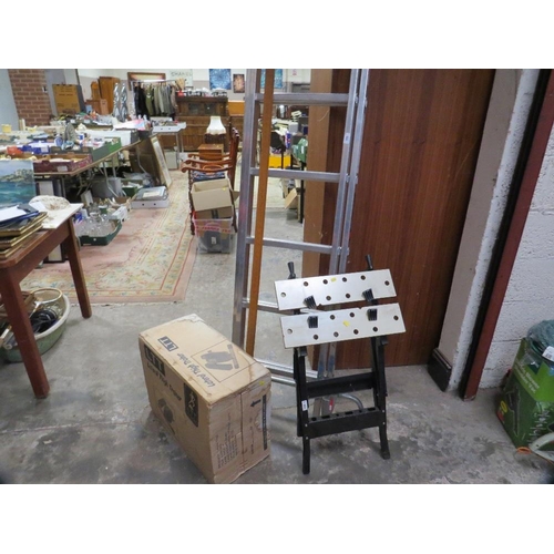 655 - A set of ladders together with a workbench and boxed stepper - contents unchecked