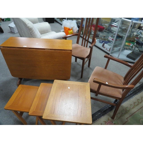 801 - A teak dropleaf dining table and two carver dining chairs together with a retro Parker Knoll nest of... 