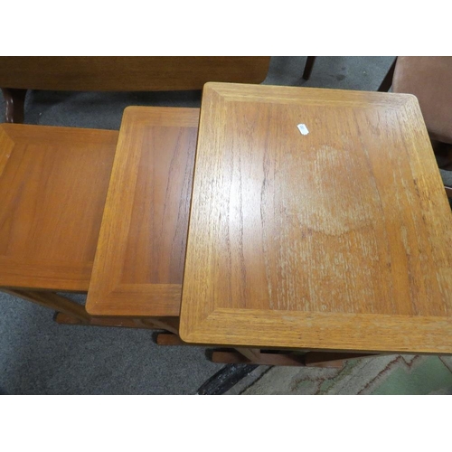 801 - A teak dropleaf dining table and two carver dining chairs together with a retro Parker Knoll nest of... 