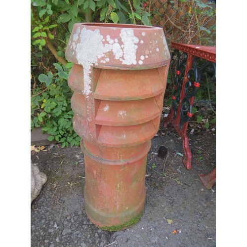 605 - A terracotta chimney pot planter