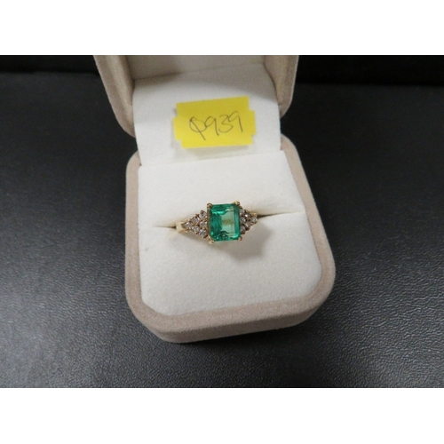 445 - An 18k emerald cut emerald and diamond ring ring size N approx. weight 5.4g