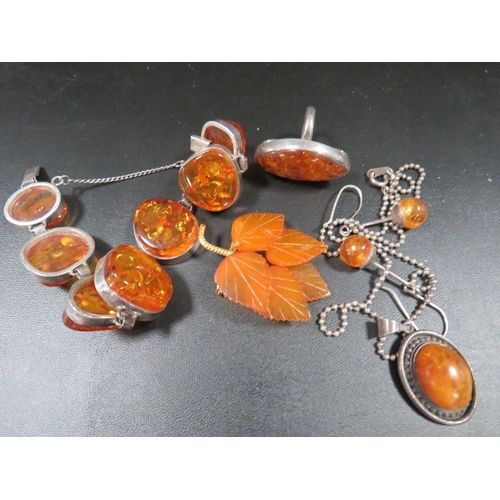 476 - A collection of silver and amber jewellery