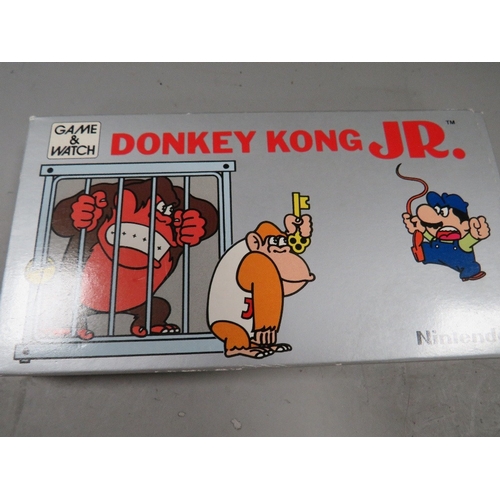 488 - A vintage Nintendo Donkey Kong JR hand held game and watch DJ-101 1982 in original box