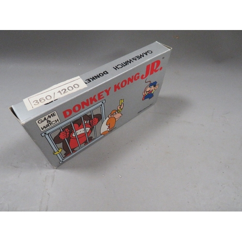 488 - A vintage Nintendo Donkey Kong JR hand held game and watch DJ-101 1982 in original box