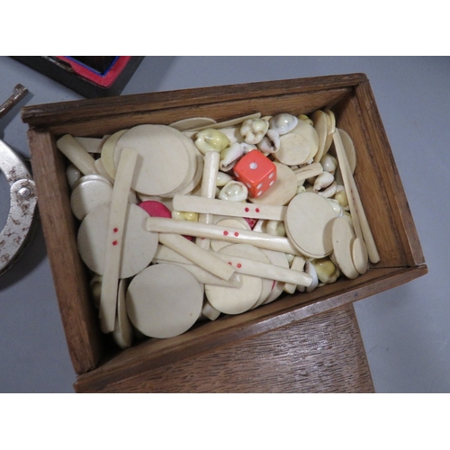 498 - A tray of assorted collectables to include vintage handcuffs, playing cards, cased instrument set, s... 