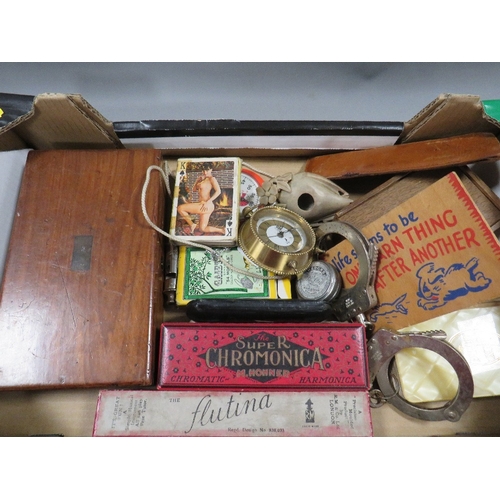 498 - A tray of assorted collectables to include vintage handcuffs, playing cards, cased instrument set, s... 