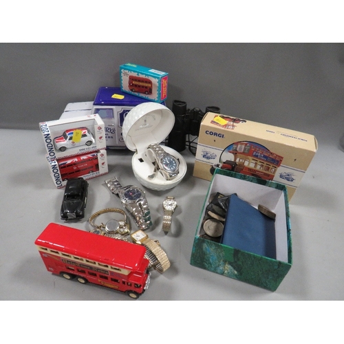 501 - A box of collectables to include Corgi models, watches, coins etc